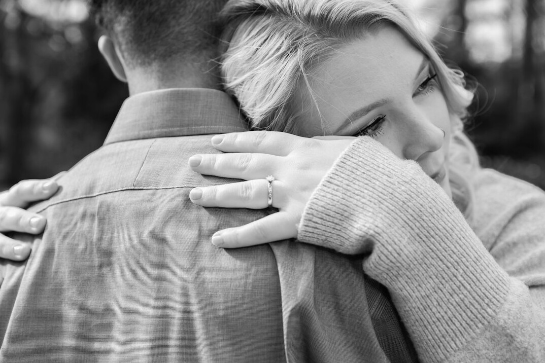 couple reconciling hug
