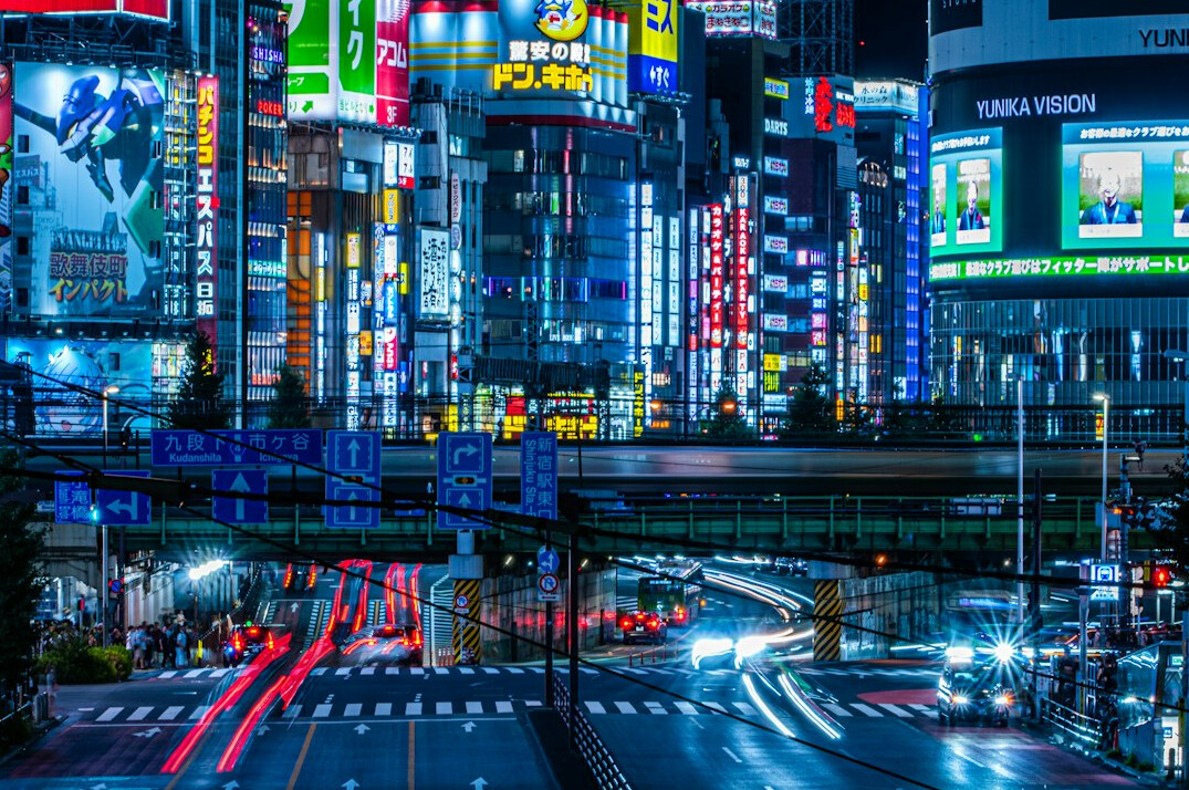 Tokyo entertainment district at night with neon signs